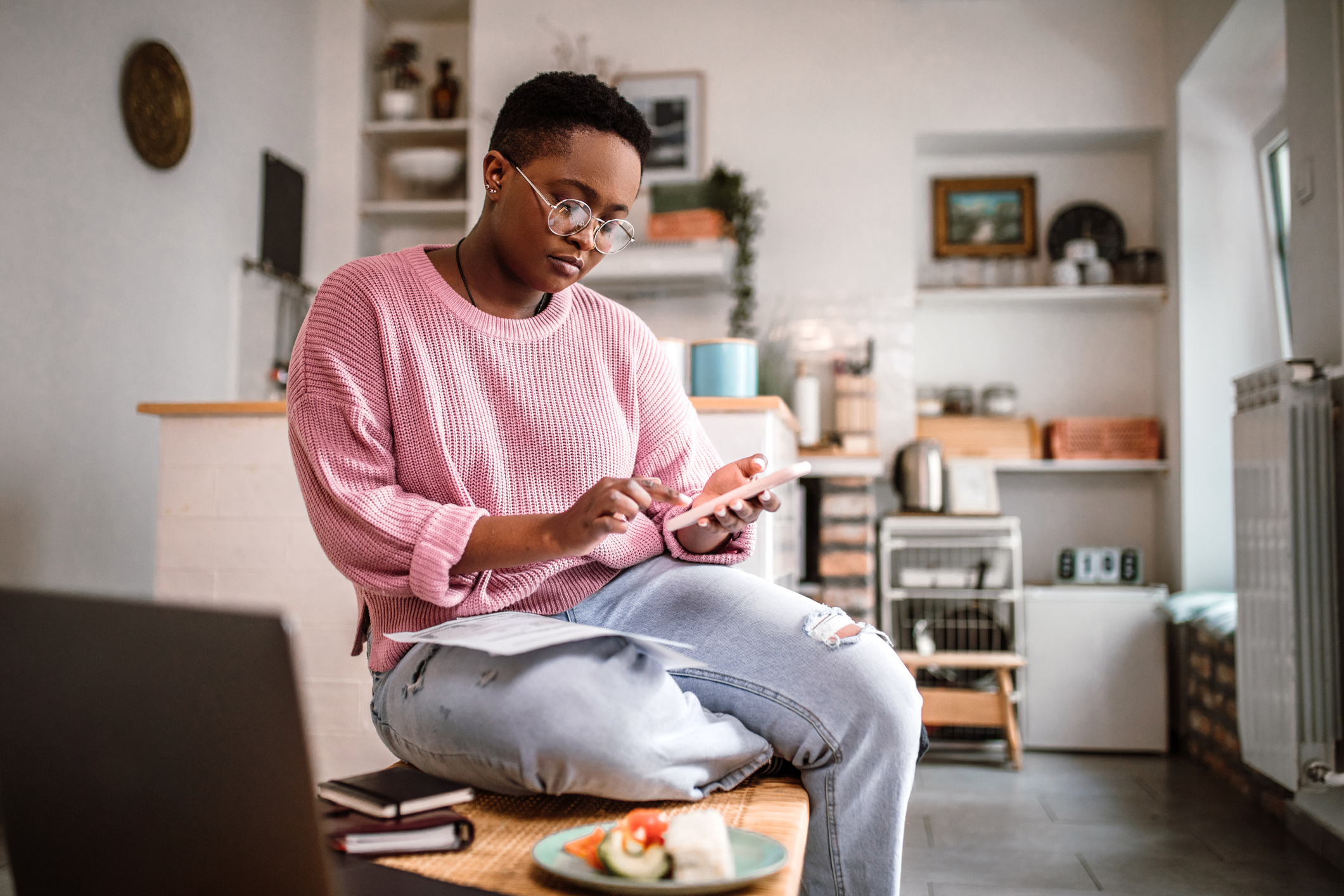 Woman At Home Checking Her Credit Report