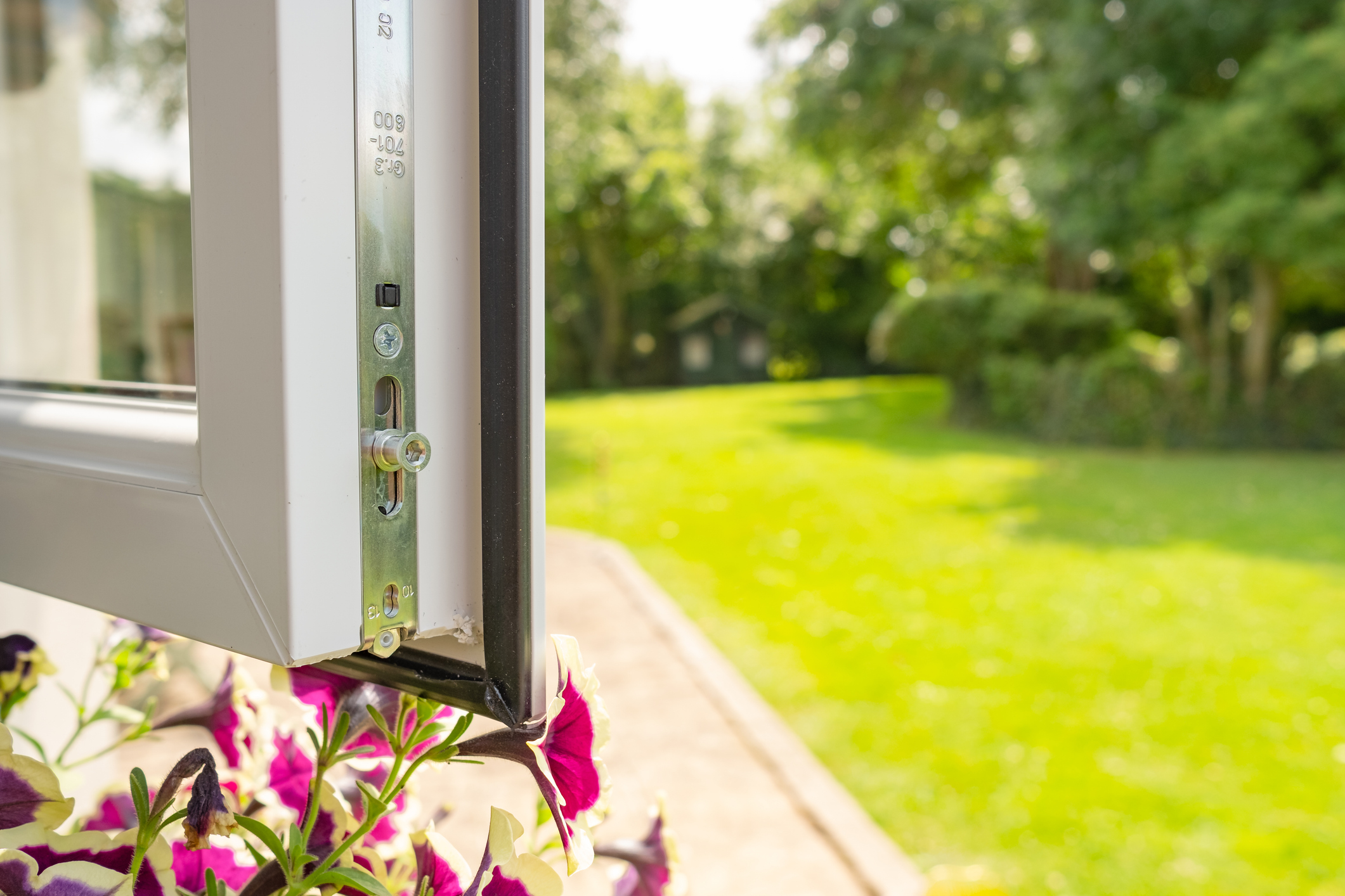 Close up of double glazed windows opening up onto a garden